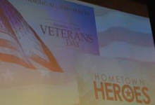 Image of a screen presentation that says Veterans Day Hometown Heroes