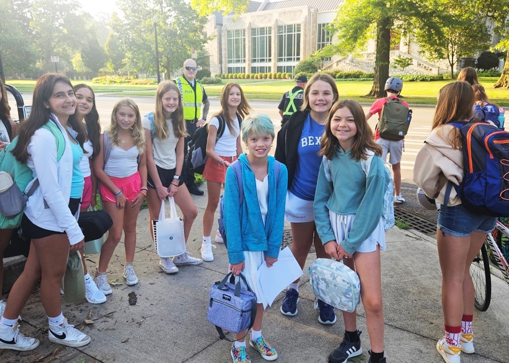 Image of a group of middle school students heading to school on the first day of classes while at an intersection manned by Bexley Police Officers